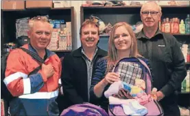  ?? Photo: TALIA CARLISLE ?? Boosting funds: Downer staff Eldon Potaka, left, and Kevin McMullan, right, check out the work of charity Foster Hope with co-ordinator Jess Anderson, and Shaun Dancer from Chorus, at All Safe in Porirua.