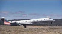  ??  ?? American Airlines flight 3109, operated by Skywest Airlines as American Eagle, takes off April 5 from the Santa Fe Municipal Airport on its flight to Phoenix.