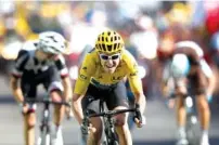  ?? THE ASSOCIATED PRESS ?? Geraint Thomas, wearing the overall leader’s yellow jersey, speeds to the finish line Thursday to win the 12th stage of the Tour de France cycling race over 109 miles. It started in Bourg-Saint-Maurice Les Arcs and ended atAlpe d’Huez, France.