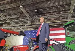  ?? Associated Press ?? President Donald Trump walks on stage to speak at Kirkwood Community College, which is recognized by the White House as a major center of agricultur­al innovation, during a visit to the campus in Cedar Rapids, Iowa, on Wednesday.