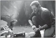  ??  ?? Chris Pratt stars as Owen in Universal Pictures’ Jurassic World:
Fallen Kingdom. It came in first at last weekend’s box office and made about $148 million.