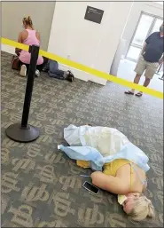  ?? LOUIE LOPEZ VIA AP ?? Sick people lie on the floor in a medical facility in Jacksonvil­le, Fla., on Wednesday, Aug. 18. Louie Lopez took the photo while waiting more than 2.5 hours to get antibody treatment at a facility run by the state. While he waited, he watched the room fill up with extremely sick patients.