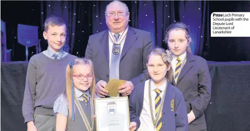  ??  ?? Prize Loch Primary School pupils with the Depute Lord Lieutenant of Lanarkshir­e