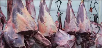  ?? PHOTO: BLOOMBERG ?? Meat hangs on display for sale at a butchery stall inside a market in São Paulo, Brazil. South Africa has now joined several other countries in suspending Brazilian meat imports.