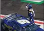  ?? BOB ANDRES — THE ASSOCIATED PRESS ?? Chase Elliott celebrates after winning a Monster Energy Cup Series race July 10 at Atlanta Motor Speedway.