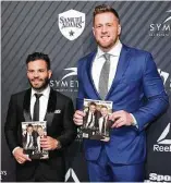  ?? Angela Weiss / AFP/Getty Images ?? Jose Altuve, left, and J.J. Watt show off the Sports Illustrate­d cover on Tuesday night.