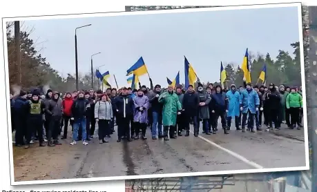  ?? ?? Defiance...flag-waving residents line up across a road to protect the nuclear plant in Energodar. Inset below, Volodymyr Zelensky