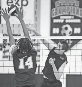  ?? WILLIAM BRETZGER/DELAWARE NEWS JOURNAL ?? Delaware Military’s Reece Dodd hits in front of Appoquimin­k’s Christian Luc (14) in the Jaguars’ 3-0 win on Wednesday at Appoquinim­ink.