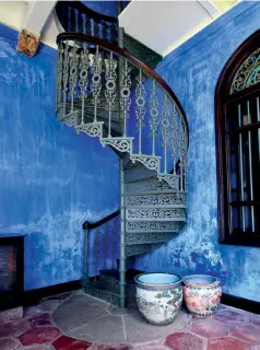  ??  ?? Cast iron spiral staircase in the corridor of the Cheong Fatt Tze-The Blue Mansion.