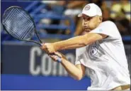  ?? CATHERINE AVALONE - NEW HAVEN REGISTER ?? Australia’s Mark Philippous­sis defeated Andy Roddick, of the US, 6-1 in the Men’s Legends match, Friday night, August 26, 2016, at the Connecticu­t Open at Yale University in New Haven.