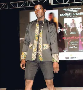  ??  ?? Saint’s Male Fashion Face of the Caribbean 2018, Oshane Flemmings, on the runway.