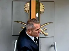  ?? AP ?? A security guard looks out of the entrance of Saudi Arabia’s consulate in Istanbul.