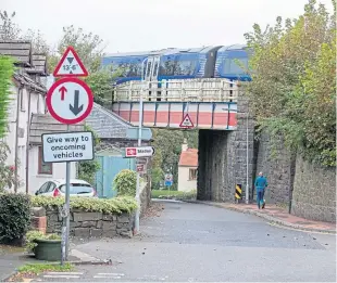  ?? Picture: Kenny Smith. ?? The rail bridge on Ferryhill Road, near North Queensferr­y train station, is too low for the collection lorries.