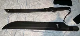  ??  ?? Deadly: Machete among the weapons found by police