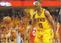  ?? Tony Dejak / aP ?? Tristan Thompson reacts after dunking in a playoff game last month. The former Findlay Prep star is reaping praise from Cleveland teammate LeBron James as the Cavaliers compete for an NBA title.