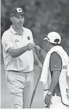  ?? ROB CARR/GETTY IMAGES ?? Matt Kuchar celebrates one of his seven birdies Thursday in the Mayakoba Golf Classic.