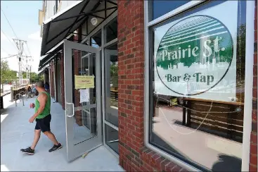  ?? NWA Democrat-Gazette/J.T. WAMPLER ?? Dan Daniel takes a break from painting Thursday at Prairie St. Bar &amp; Tap in Fayettevil­le. The new watering hole, opening later this summer, will be a private club. A state law enacted last year requires municipali­ties to approve private club applicatio­ns before the state reviews them. The Fayettevil­le City Council approved the business’ private club applicatio­n in April. Daniel is the general manager at the club.