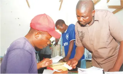  ??  ?? ZBC staffer Andrew Neshamba (right) casts his vote in Mt Darwin, Mashonalan­d Central Province, where he is eyeing a seat in the National Assembly. - (Picture by Kudakwashe Hunda)