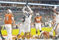  ?? LYNNE SLADKY/AP ?? Virginia free safety Joey Blount (29) reacts after Miami running back Cam’Ron Harris (23) was tackled for a safety during a Sept. 30 game in Miami Gardens, Florida.