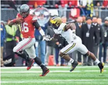  ?? GREG BARTRAM, USA TODAY SPORTS ?? J.T. Barrett and Ohio State are second in the College Football Playoff rankings and don’t play this weekend, meaning they probably are locks to make the final four.