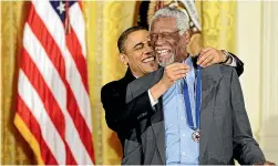  ?? AP ?? Bill Russell in full flight for the Boston Celtics in 1963 and, above, being presented with the Presidenti­al Medal of Freedom by US President Barack Obama in 2011.