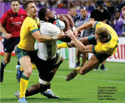  ??  ?? Crunch: Hodge (right) bounces off Fiji flanker Yato after a huge collision
