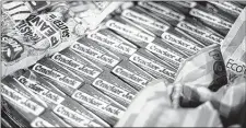  ?? GENE J. PUSKAR/ASSOCIATED PRESS ?? A vendor’s tray at PNC Park in Pittsburgh is stocked with peanuts, popcorn and Cracker Jack boxes, minus their iconic prize inside.