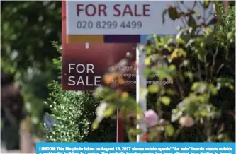  ?? —AFP ?? LONDON: This file photo taken on August 13, 2017 shows estate agents’ “for sale” boards stands outside a residentia­l building in London. The capital’s housing sector has been affected by a decline in investment from abroad which many experts have blamed on last year’s Brexit referendum.