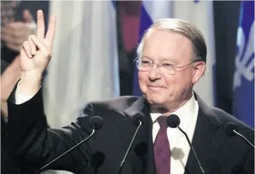  ?? PAUL CHIASSON / THE CANADIAN PRESS FILES ?? Bernard Landry, officially acclaimed leader of the Parti Québécois, gives a victory sign as he is applauded as he takes the stage in St-Hyacinthe, Que., in 2001.