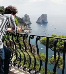  ??  ?? A clifftop terrace at Hotel Luna overlooks Capri’s Faraglioni sea stacks.