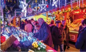  ?? Photograph: Jochen Tack/Alamy ?? Strasbourg Christmas market in 2015. Local authoritie­s are trying hard to lift the glum mood this Christmas amid the war in Ukraine and the rising cost of living.