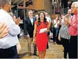  ?? OKLAHOMAN] ?? Sen. Stephanie Bice walks into her watch party to give a speech on Tuesday after wining the Republican runoff election for 5th District congressio­nal seat. [SARAH PHIPPS/ THE