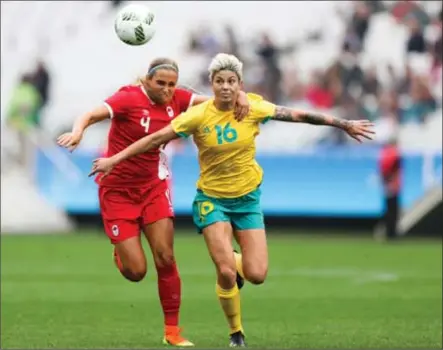  ?? ALEXANDRE SCHNEIDER, GETTY IMAGES ?? Canada’s Shelina Zadorski, left, and Australia’s Michelle Heiman chase the ball during Canada’s opening 2-0 win.
