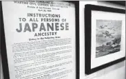  ?? STEVEN SENNE/AP ?? The “Why We Still Remember” exhibit in Natick, Mass., also shows the experience­s of Japanese families forced into internment camps after the 1941 attack on Pearl Harbor.