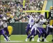  ?? MIKE ROEMER - THE ASSOCIATED PRESS ?? FILE - In this Sept. 15, 2019, file photo, Minnesota Vikings quarterbac­k Kirk Cousins throws a pass during the second half of the team’s NFL football game against the Green Bay Packers in Green Bay, Wis. Cousins and the Minnesota Vikings finally have the opportunit­y to avenge a damaging defeat in Green Bay in the second game of the season. They host the rematch with the Packers, on track for the playoffs with the chance to prevent their chief rival from clinching the division title on their home turf. The Packers won the first meeting 21-16, after Cousins threw a dangerous pass in the fourth quarter that was intercepte­d in the end zone.