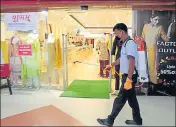  ?? RAHUL GROVER/HT ?? A worker sanitises an area inside a mall as it reopens three months after the lockdown in Gurugram on Wednesday.