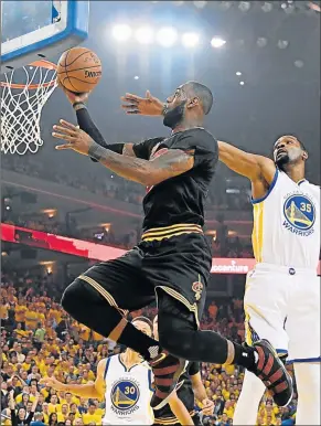  ?? Picture: TPX IMAGES ?? BASKET FULL OF TRICKS: Cleveland Cavaliers forward LeBron James shoots against Golden State Warriors forward Kevin Durant (35) during the first quarter in game five of the 2017 NBA Finals at Oracle Arena. Warriors have taken an unassailab­le 4-1 lead in...