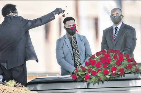  ?? Jason Armond Los Angeles Times ?? NICHOLAS JACKSON, center, mourns his father, Charles Jackson Jr., in Inglewood in April. The elder Jackson died of COVID-19.