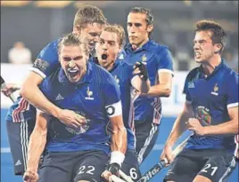  ?? AFP ?? ■ France's Victor Charlet (centre) celebrates a goal against Argentina in Bhubaneswa­r on Thursday.