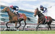  ?? /Reuters ?? Family affair: Rekindling, ridden by Corey Brown, wins the Melbourne Cup ahead of second-placed Johannes Vermeer at Flemington Racecourse in Melbourne on Tuesday.