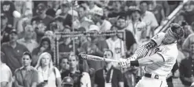  ?? THE ASSOCIATED PRESS ?? The Washington Nationals’ Bryce Harper hits during the Home Run Derby on Monday at Nationals Park. Harper defeated Kyle Schwarber 19-18 in the final.