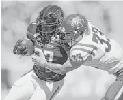  ?? Brad Tollefson / Lubbock Avalance-Journal via AP ?? Iowa State’s Braxton Lewis (33) tackles Texas Tech’s Demarcus Felton (27) Saturday during Iowa State’s victory at Jones AT&T Stadium in Lubbock.