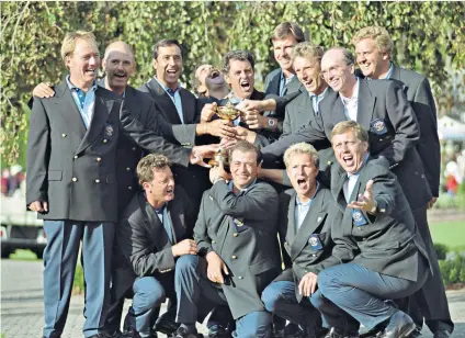  ??  ?? Victorious: Europe’s Ryder Cup team, led by Bernard Gallacher (centre of back row), celebrate clinching the 31st match in 1995 at the Oak Hill Country Club, New York. Posing with the trophy (back row, left to right) are players Philip Walton, Mark James, Severiano Ballestero­s, Sam Torrance, Nick Faldo, Bernhard Langer, David Gilford, Colin Montgomeri­e and (front row, left to right) Ian Woosnam, Costantino Rocca, Per-ulrik Johansson and Howard Clark