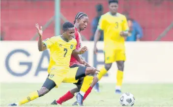  ?? CONCACAF, COM PHOTO ?? Daryl Massicot (left) of Jamaica defending during the match between Jamaica and Antigua & Barbuda at the 2022 Concacaf Under-20 Championsh­ip held at the Francisco Morazán stadium in San Pedro Sula, Honduras on June 22. Jamaica won 2-0.