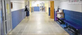  ?? Westside Eagle Observer/MIKE ECKELS ?? With all the classroom floors complete, the north hallway at Decatur High School awaits its four coats of wax June 18. The asbestos floor tiles were removed to make way for Phase 2 of the high school renovation project slated to begin in August 2021.