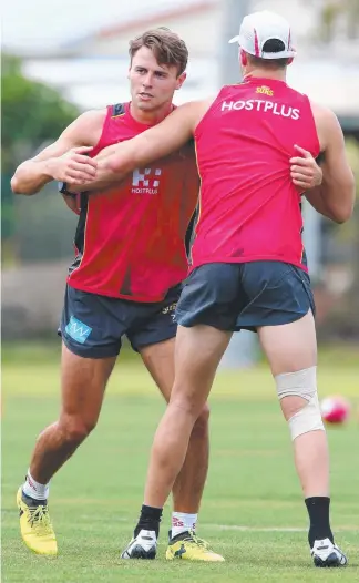  ??  ?? Gold Coast Suns recruit Lachie Weller (above, left) will form a strong combinatio­n with Kade Kolodjashn­ij (right) in the AFL club’s defensive line next season.