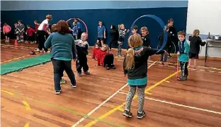  ??  ?? About 200 students congregate­d at Sanson School for the annual Te Kawau Gymnastics festival on Friday. All students were led through a variety of gymnastics. Activities ranged from hula hoops to ribbon exercises to beam, mat and beetle exercises. The...