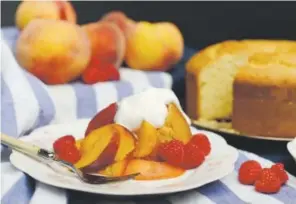  ??  ?? Fragrant orange and lemon cake topped with peaches, raspberrie­s and whipped cream. Amy Brothers, The Denver Post