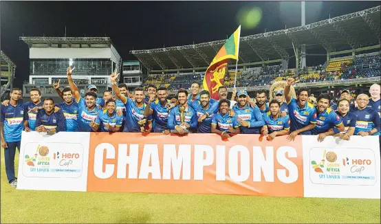  ??  ?? Sri Lanka’s cricket team poses for photograph­ers after their victory in the internatio­nal Twenty20 cricket match between Sri Lanka and South Africa at the R. Premadasa Stadium in Colombo,on Aug 14. (AFP)