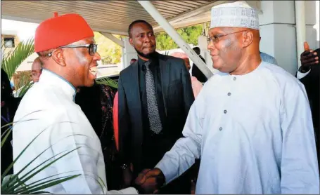  ??  ?? Former Vice President, Atiku Abubakar (right), and Governor Ifeanyi Okowa of Delta State at the Nnamdi Azikiwe Internatio­nal Airport in Abuja....Monday.